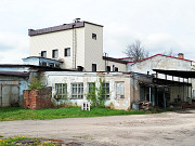 Здание производственного корпуса 2366 кв. м и земельный участок в городе Луга Луга